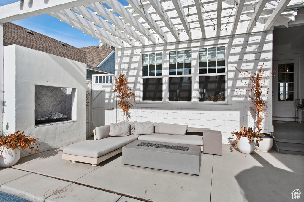 View of patio / terrace with an outdoor living space and a pergola