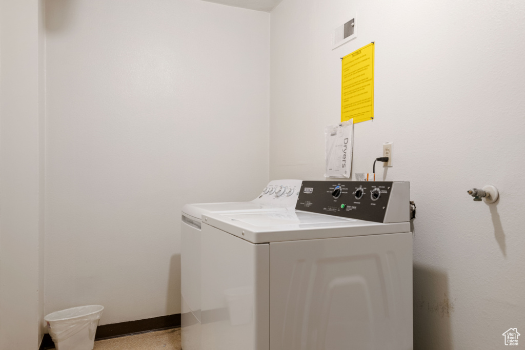 Laundry area with washer and clothes dryer
