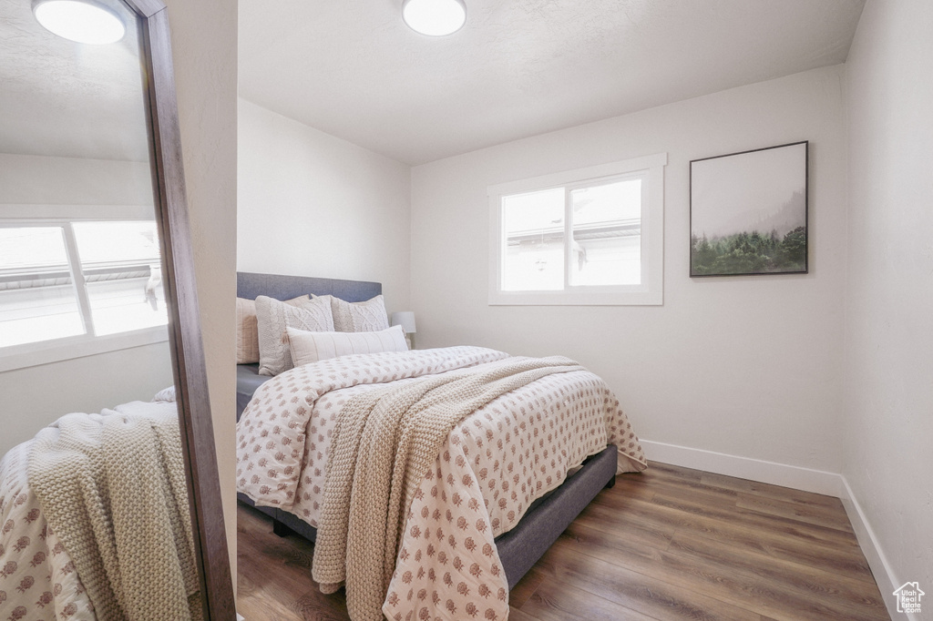 Bedroom featuring dark hardwood / wood-style floors