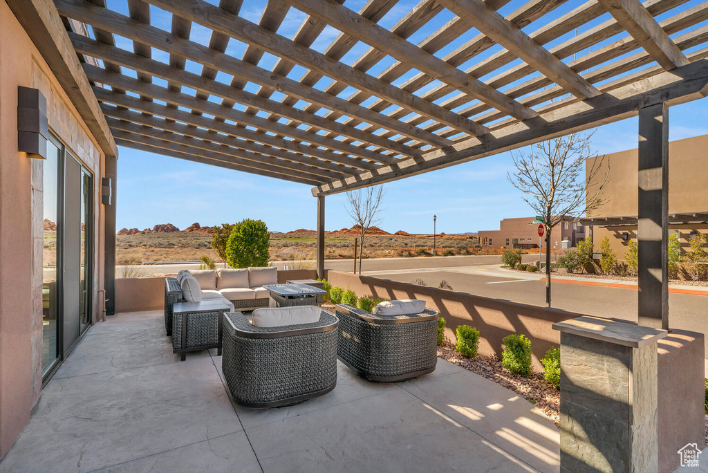View of patio / terrace with an outdoor living space and a pergola