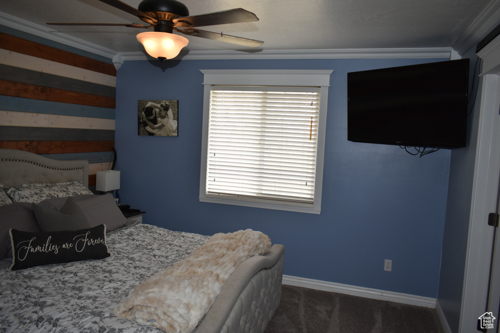 Bedroom with crown molding and ceiling fan