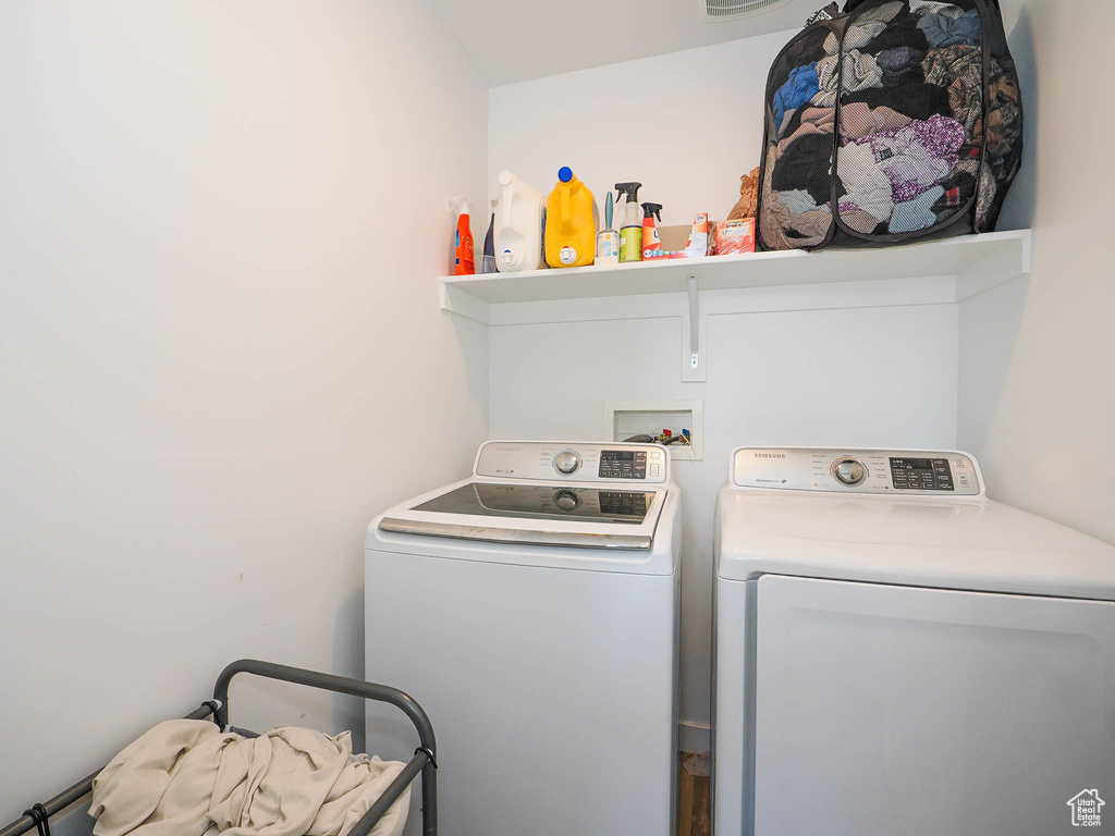 Laundry room with hookup for a washing machine and separate washer and dryer