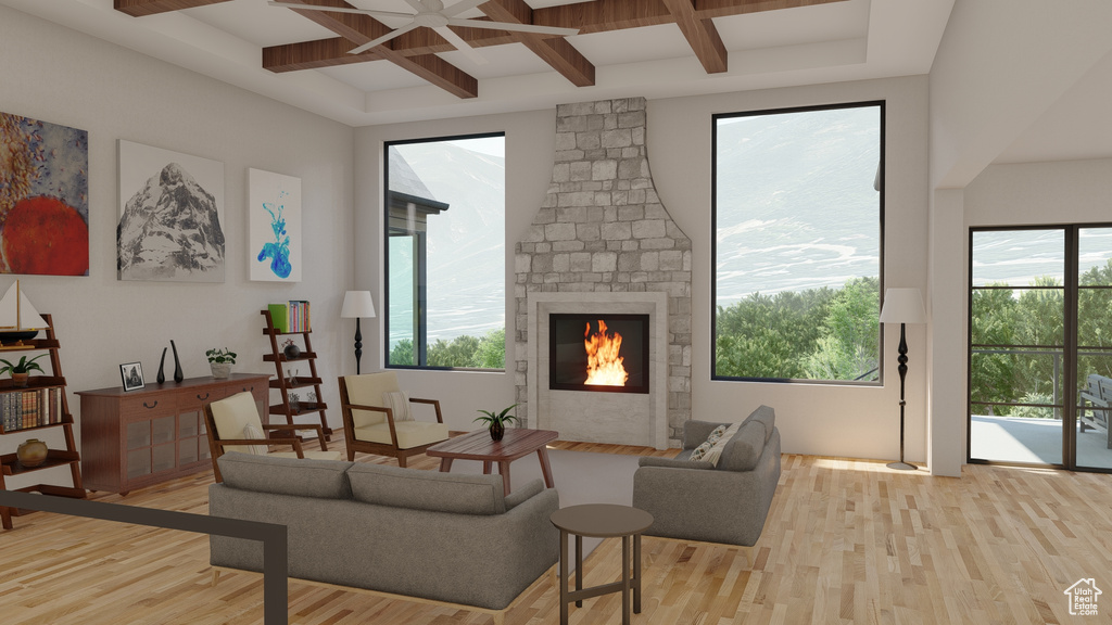 Living room featuring ceiling fan, a fireplace, beam ceiling, light hardwood / wood-style flooring, and coffered ceiling