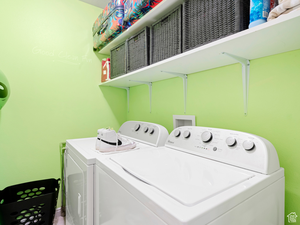 Washroom featuring washer and clothes dryer and hookup for a washing machine