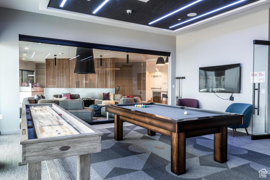 Game room featuring dark colored carpet and billiards