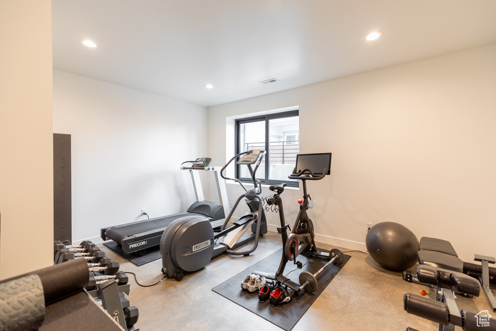 Exercise room featuring light colored carpet