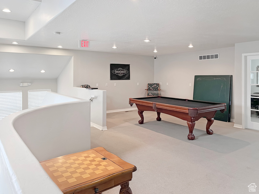 Playroom with light carpet and pool table