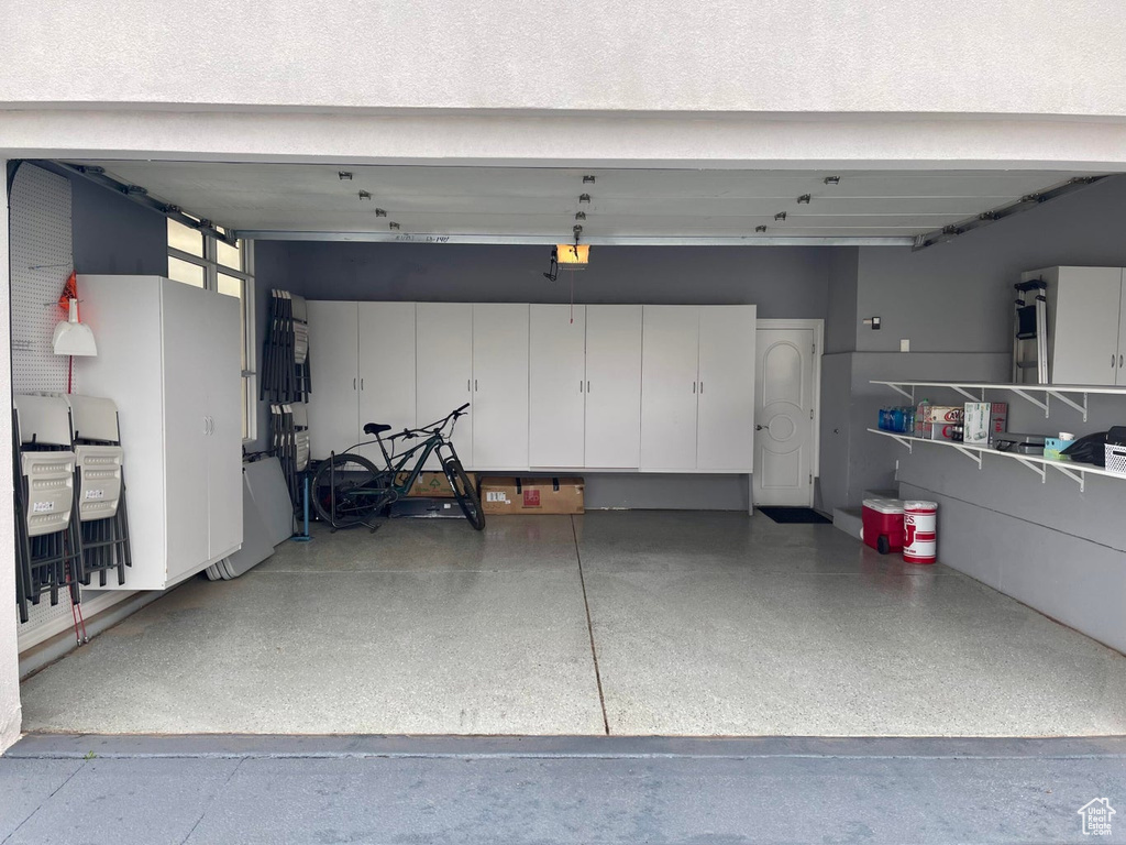 Garage featuring a garage door opener