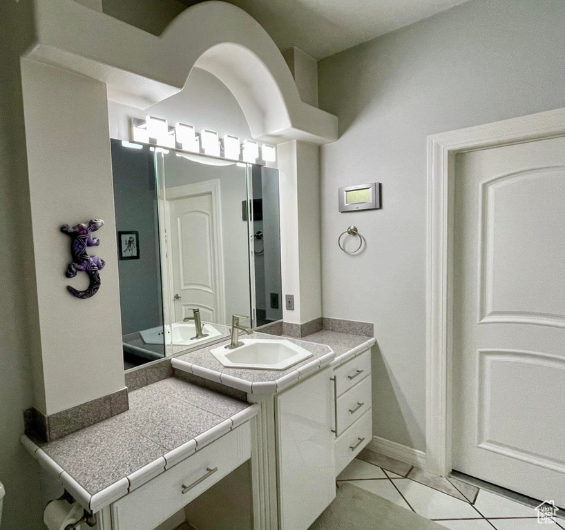 Bathroom with vanity and tile floors