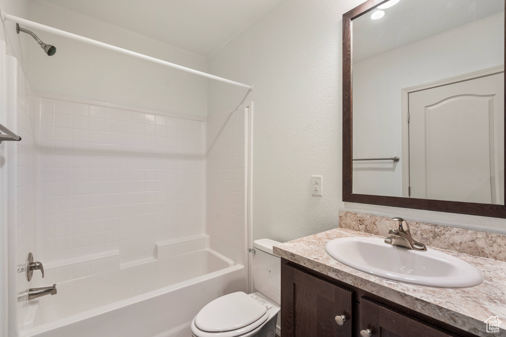 Full bathroom featuring shower / bathtub combination, oversized vanity, and toilet