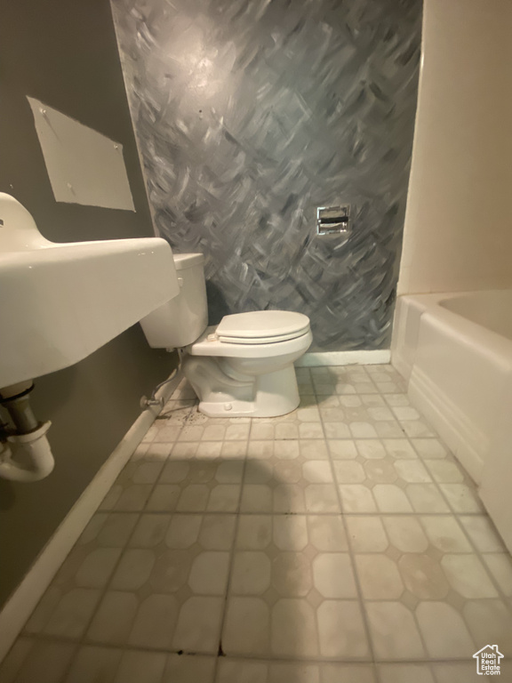 Bathroom with tile flooring and toilet