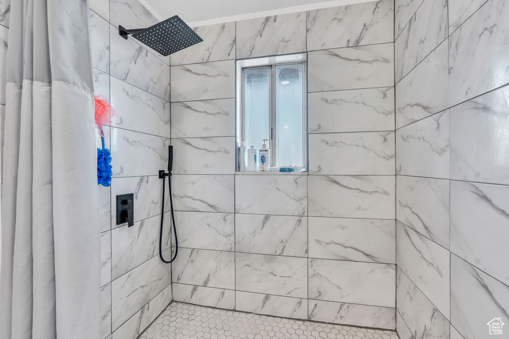 Bathroom featuring a shower with shower curtain