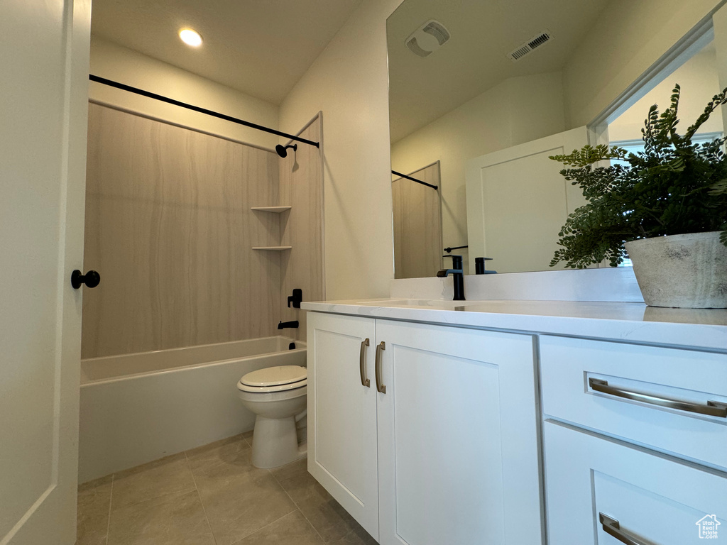 Full bathroom with vanity, toilet, tub / shower combination, and tile flooring