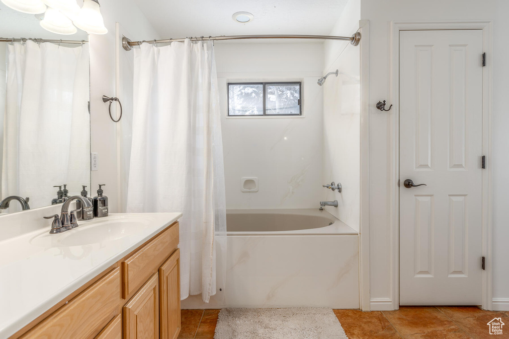 Bathroom with vanity, tile flooring, and shower / bath combination with curtain