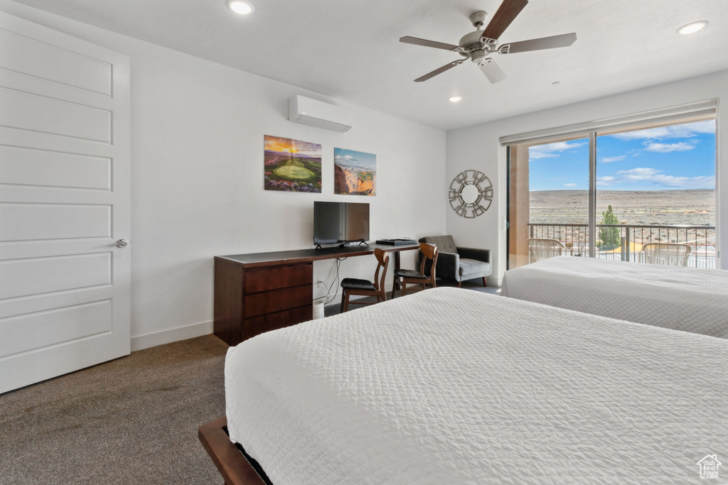 Bedroom with dark colored carpet, access to outside, ceiling fan, and a wall mounted AC