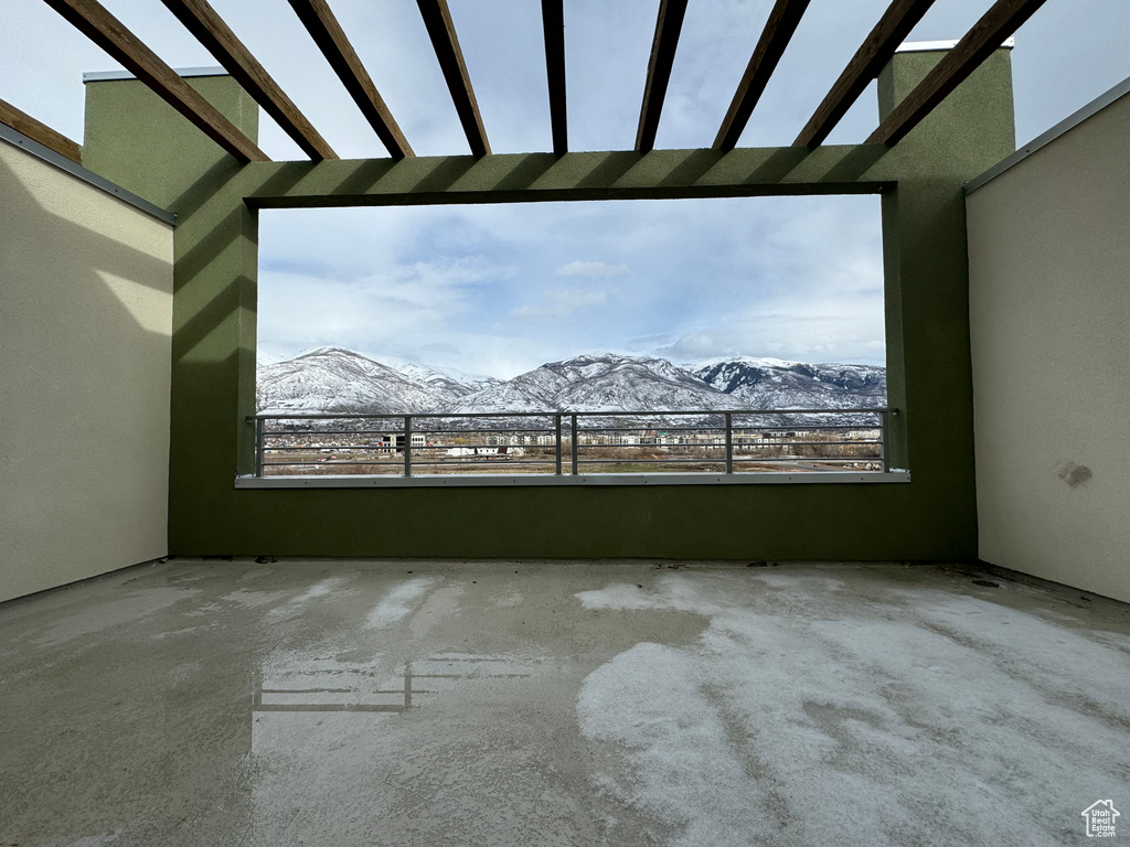 Empty room with a mountain view and plenty of natural light