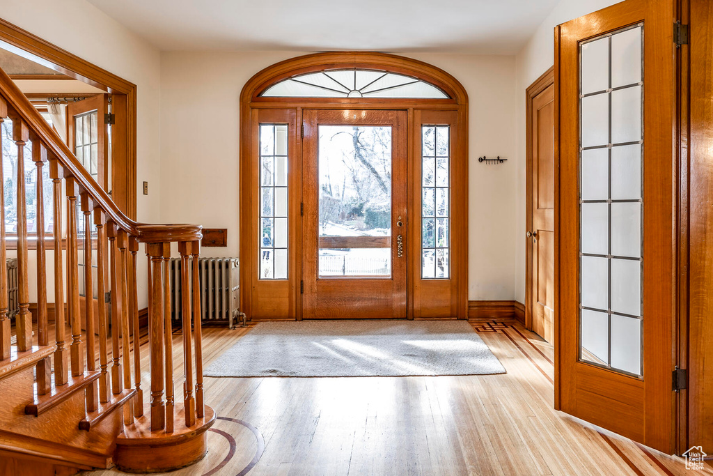 Entryway featuring radiator and light hardwood / wood-style flooring