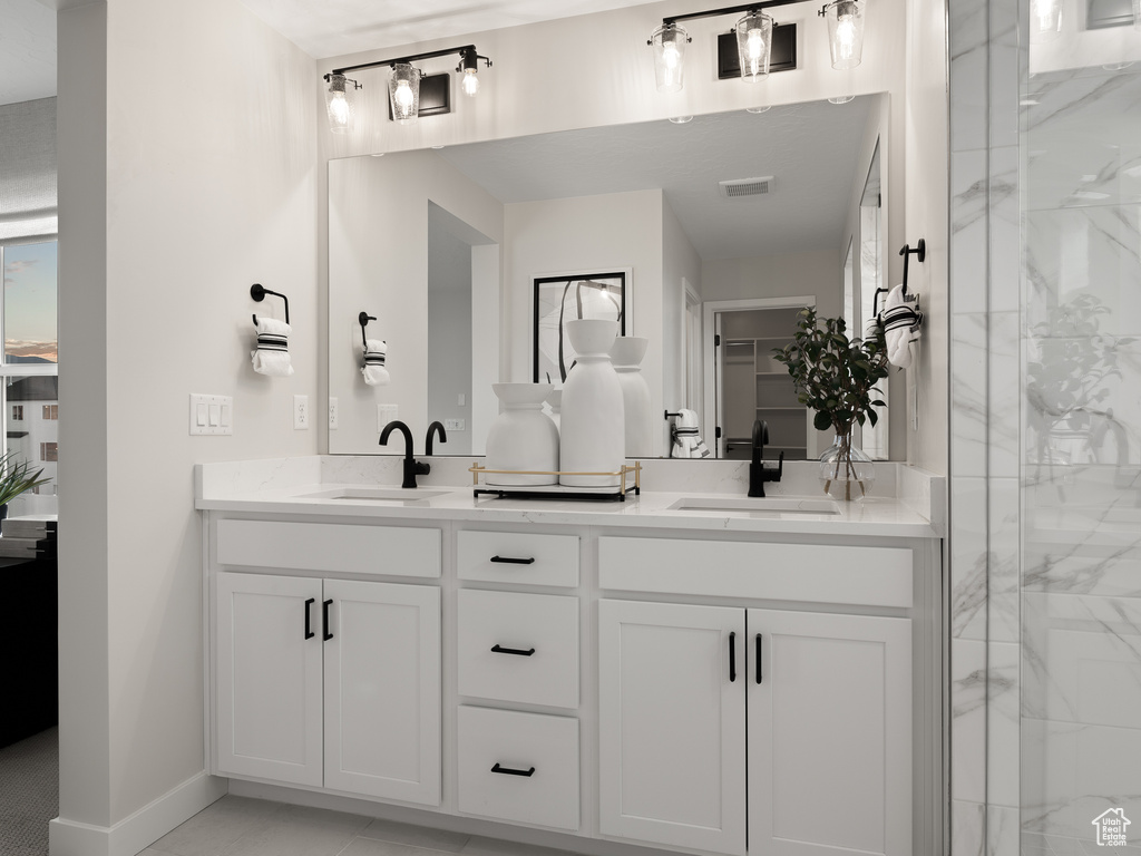 Bathroom with dual vanity and walk in shower