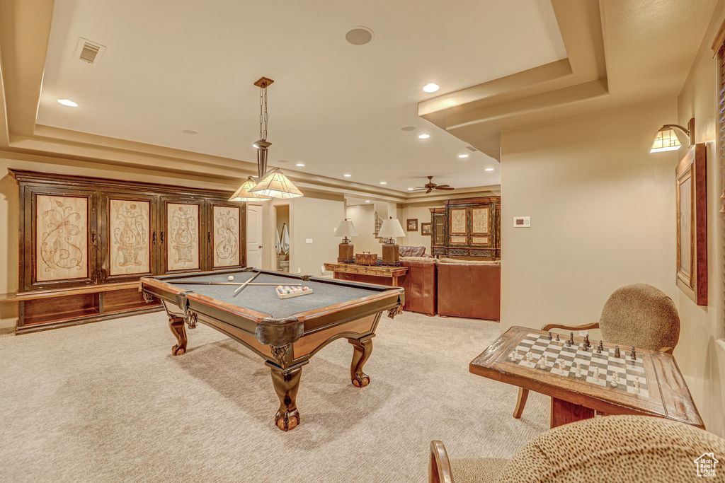 Rec room featuring light carpet, billiards, a tray ceiling, and ceiling fan