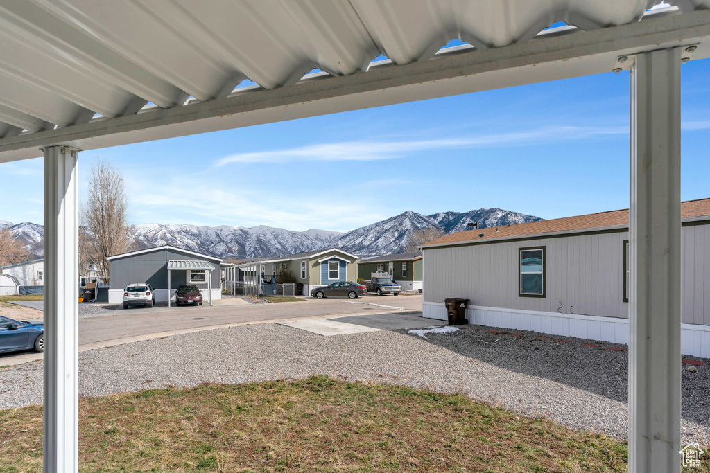 View of yard featuring a carport and a mountain view