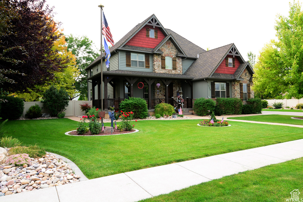 Craftsman-style house with a front lawn