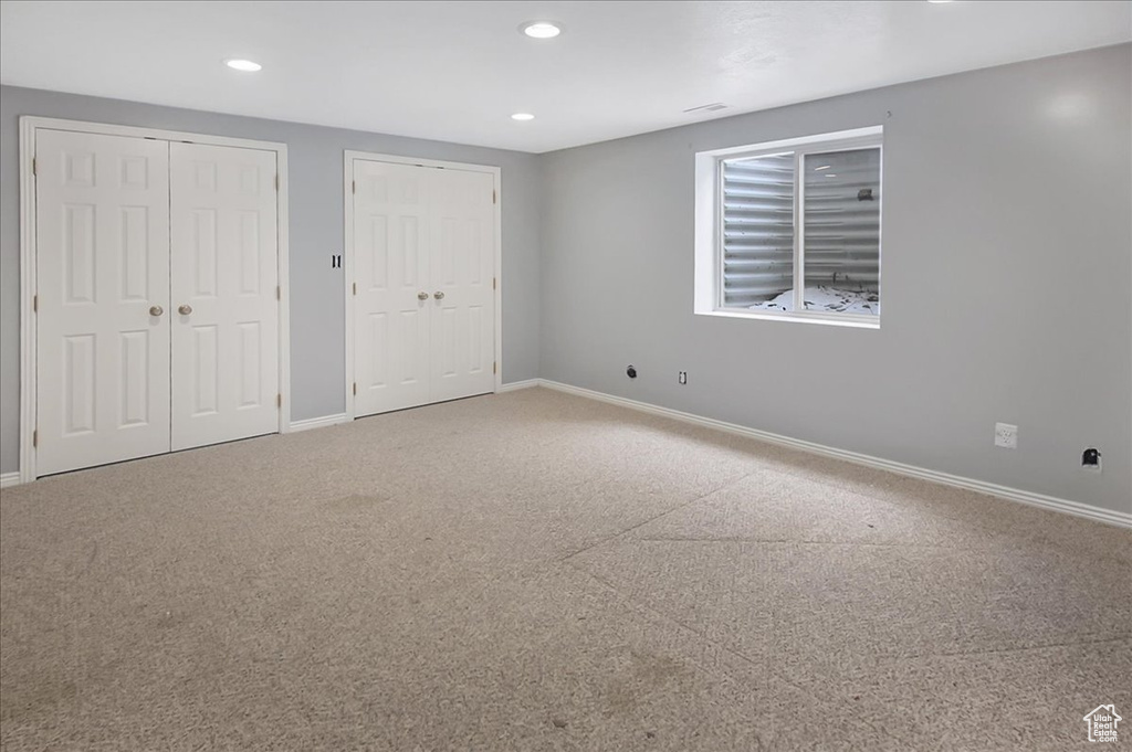 Unfurnished bedroom with two closets