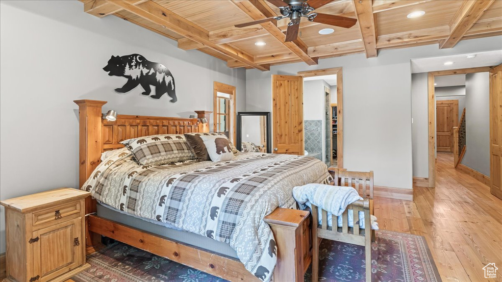 Bedroom with ceiling fan, wood ceiling, light hardwood / wood-style floors, and beamed ceiling