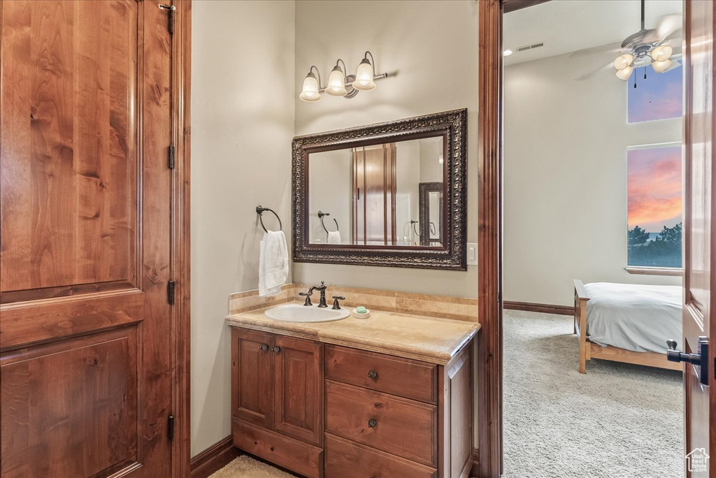 Bathroom with vanity and ceiling fan