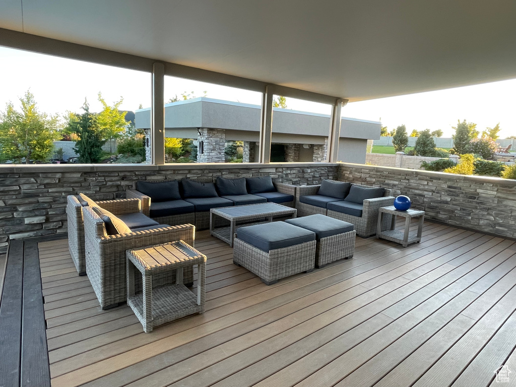 Wooden deck featuring an outdoor hangout area