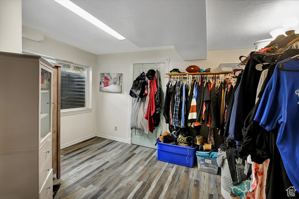 Walk in closet featuring hardwood / wood-style flooring