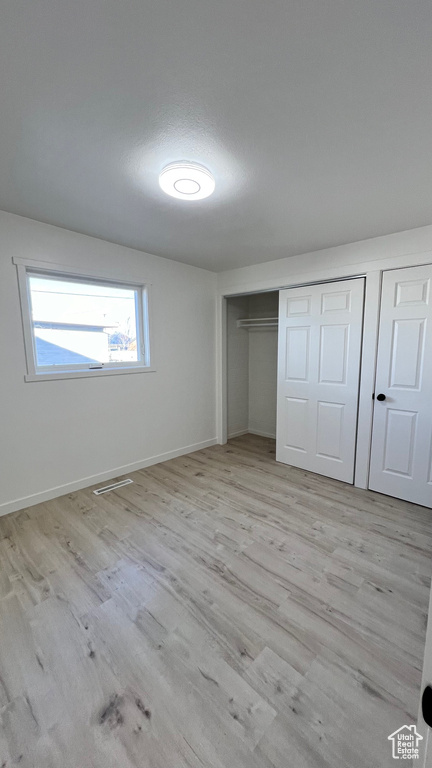 Unfurnished bedroom featuring light hardwood / wood-style flooring