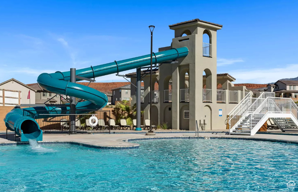 View of pool with a water slide