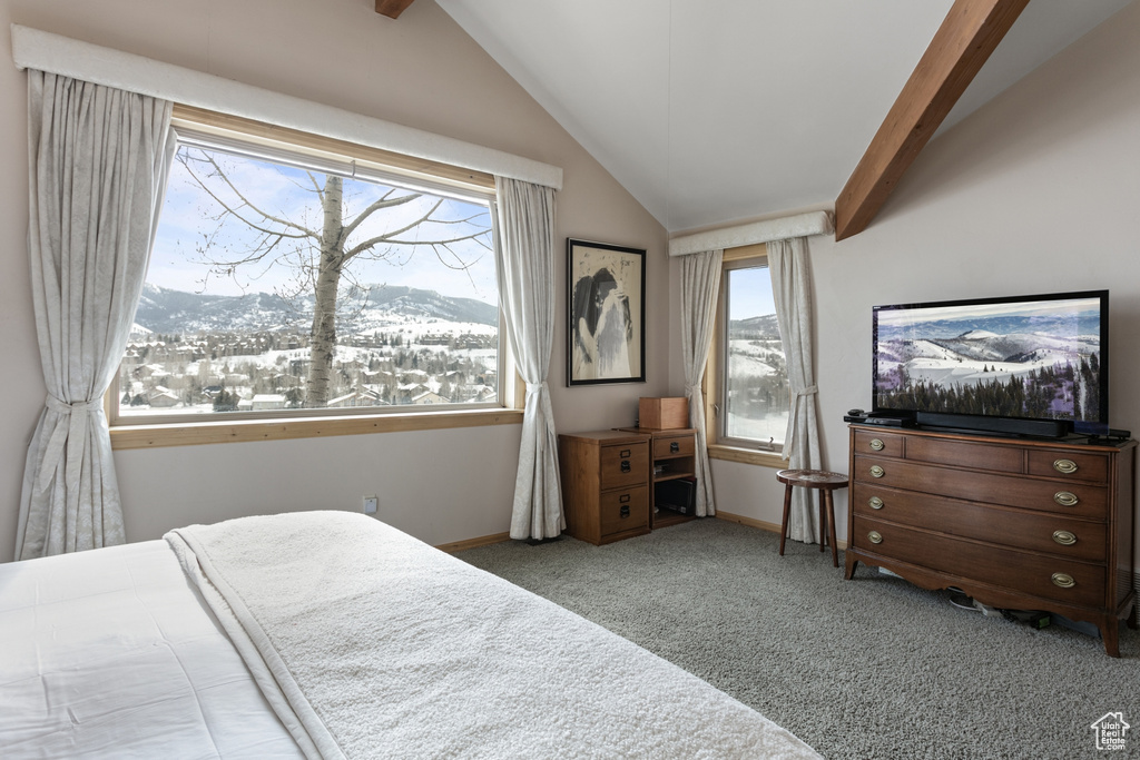 Bedroom with light carpet, a mountain view, and lofted ceiling with beams