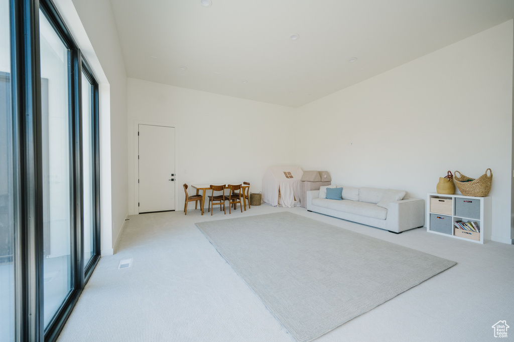Interior space with plenty of natural light and light carpet