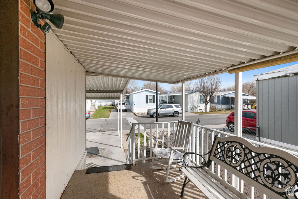 View of patio with a carport