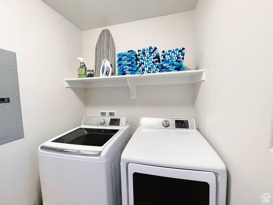 Laundry area with washing machine and clothes dryer