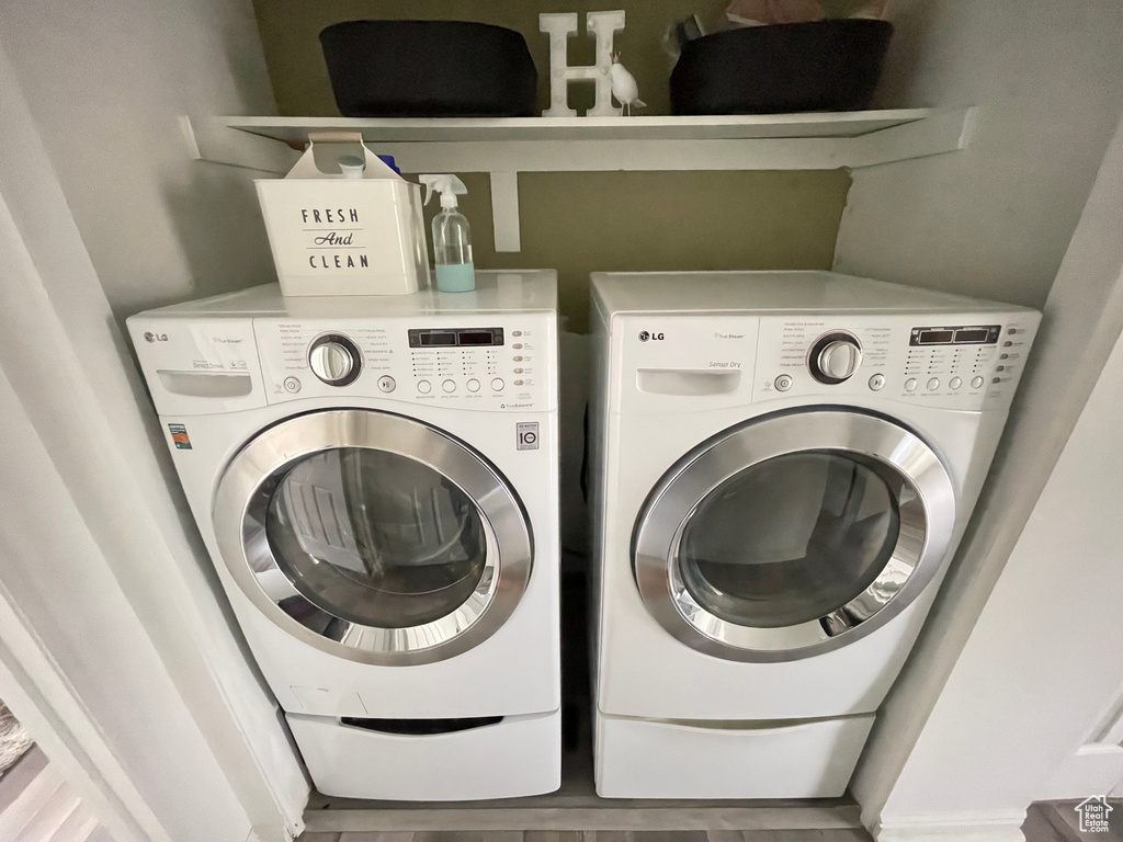 Clothes washing area featuring independent washer and dryer
