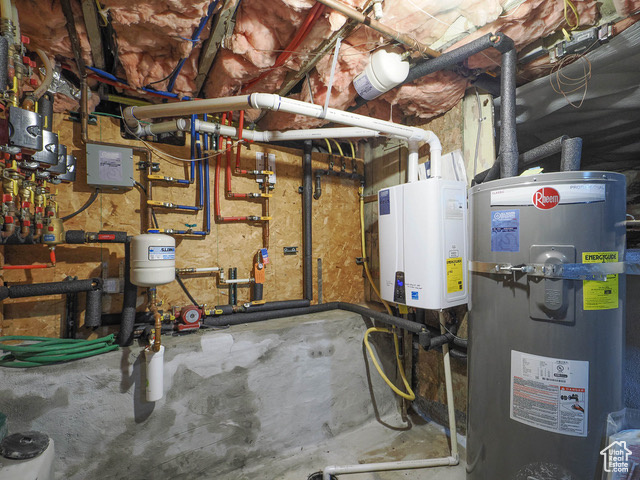 Utility room with tankless water heater and water heater