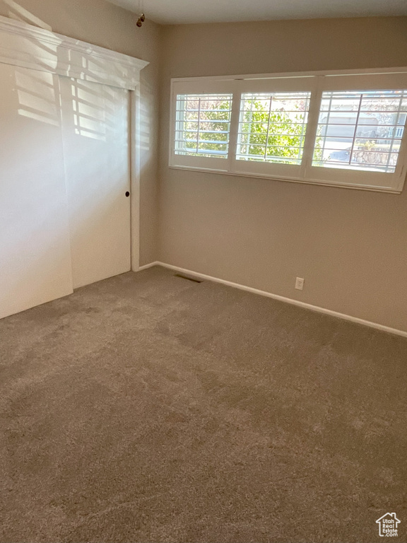 Unfurnished bedroom featuring carpet floors