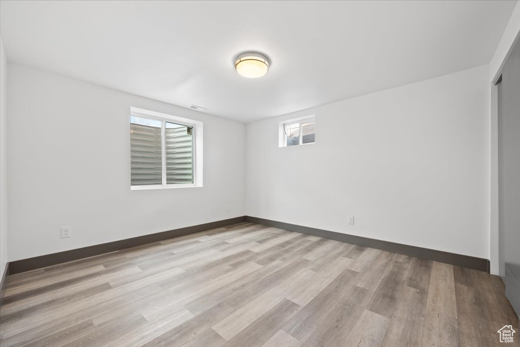 Unfurnished room featuring a wealth of natural light and light wood-type flooring