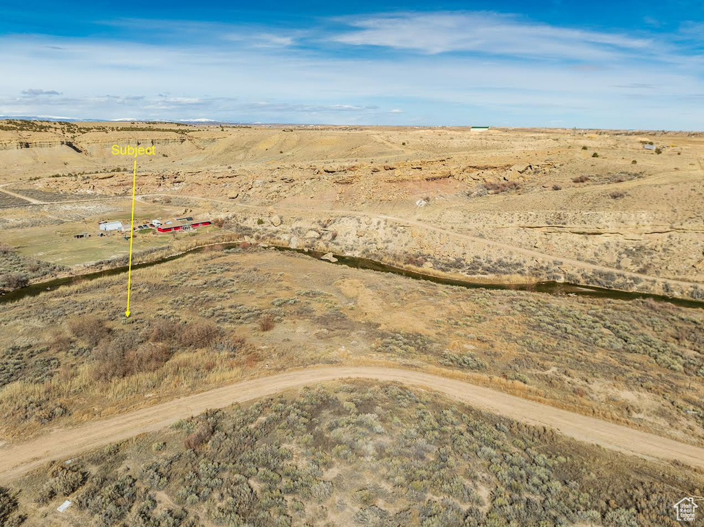 Birds eye view of property featuring a rural view