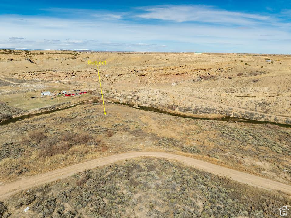 Birds eye view of property with a rural view