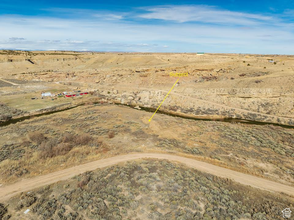 Birds eye view of property featuring a rural view