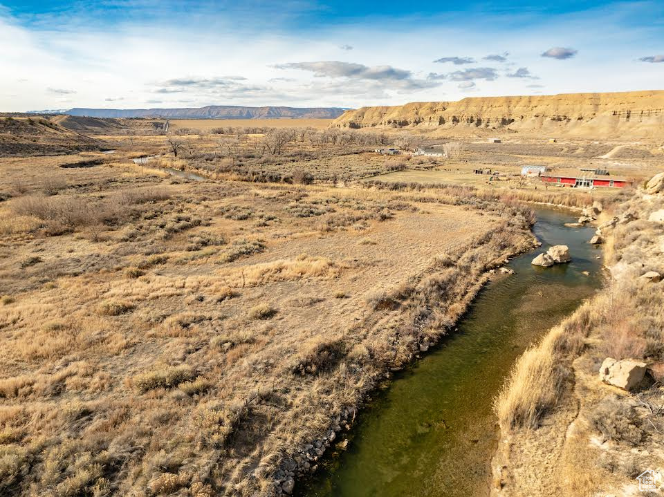 Drone / aerial view with a water and mountain view