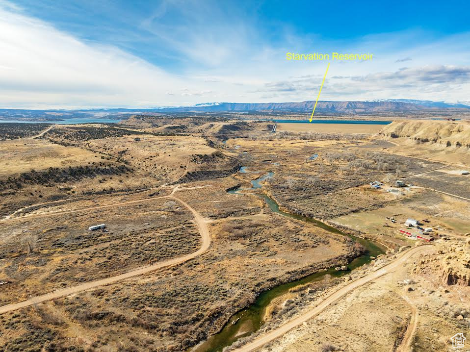 Bird\'s eye view with a water and mountain view