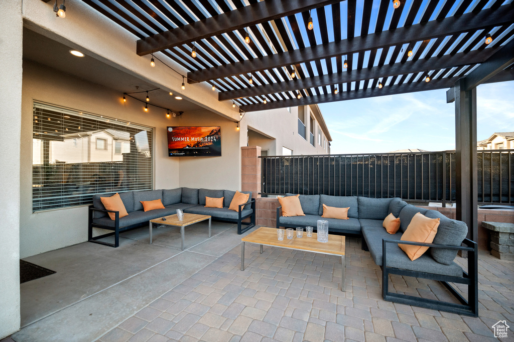 View of patio with outdoor lounge area and a pergola