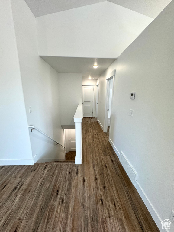 Corridor featuring dark hardwood / wood-style flooring
