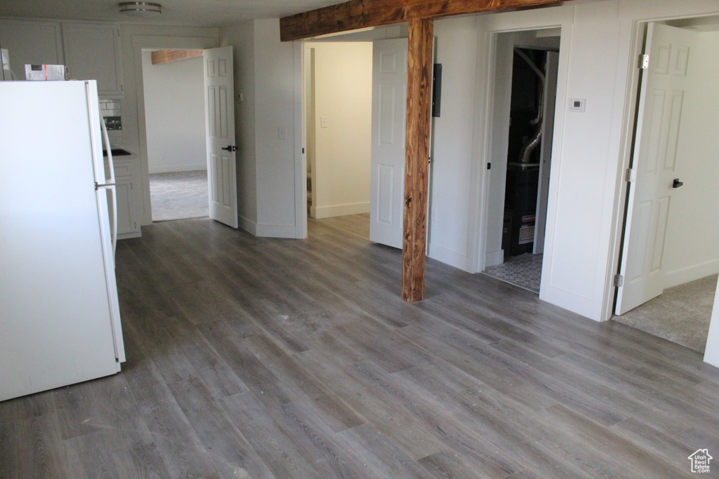 Interior space featuring dark hardwood / wood-style floors and white refrigerator