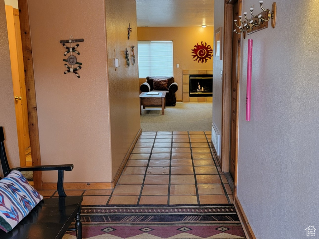 Hall featuring light tile flooring