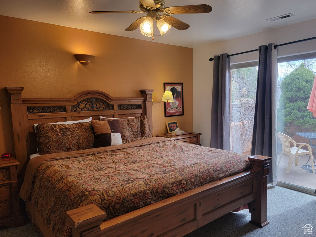 Bedroom featuring light colored carpet, access to exterior, and ceiling fan